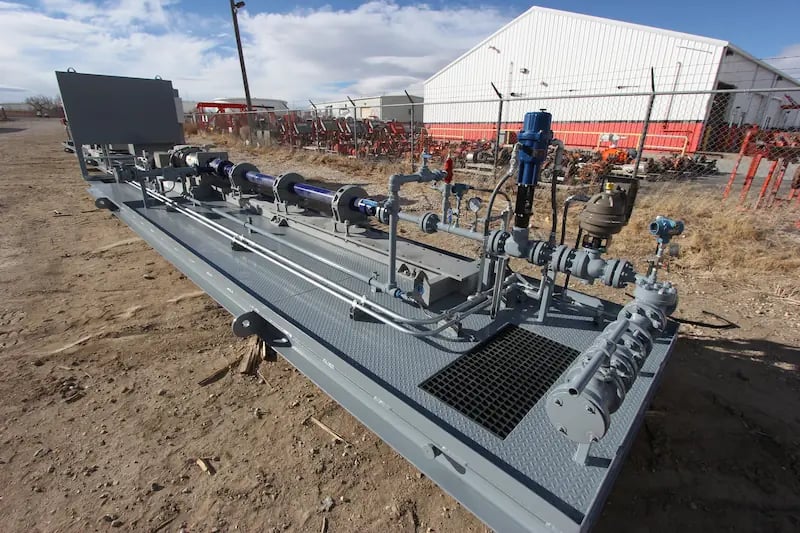 Photo of a Power Service, a DistributionNOW company, horizontal multi-stage centrifugal pump on a skid ready for use in a water disposal operation.