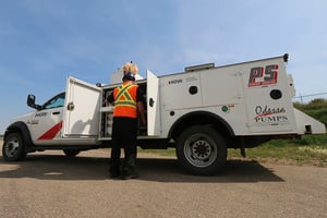 Image shows a service truck with Odessa Pumps and Power Service at the field doing repairs, installation, and preventative maintenance in the field.
